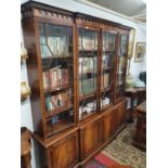 A large Mahogany Veneered four door Breakfront Bookcase.