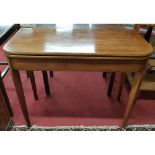 A Regency Mahogany Foldover Tea Table with boxwood inlay on tapered supports.Size W 91 x 44 x H