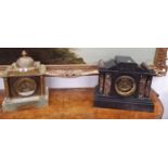 A 19th Century Black Slate and Marble mantel Clock along with an onyx example.
