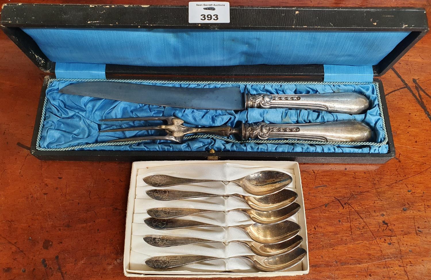 A 19th Century French Carving Set and a set of plated spoons.