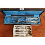 A 19th Century French Carving Set and a set of plated spoons.