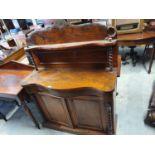 A Victorian Walnut Chiffonier with barley twist supports.