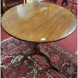 A Georgian Mahogany Supper Table with a simple splayed pod and tilting movement. 83 cms diam.