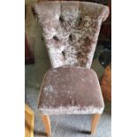 A velvet covered Chair with deep buttoned back.