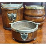 Two Oak and Brass bound Biscuit Barrels along with an oak and metal bound coaster.