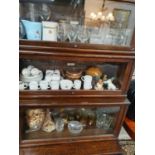 Three shelves of various Teawares etc., to include glassware and Goebel figures etc. (Please note
