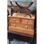 A Pine Chest along with a modern Pine Vanity Mirror and a luggage rack.