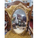 A Brass Oval Mirror.