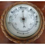 A 19th Century Aneroid Barometer along with a brass oil lamp.