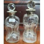 Two Hourglass Decanters with silver neck. One hallmarked Birmingham 1906.