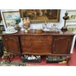 A really fine Edwardian Mahogany serpentine front Sideboard with gadrooned edge with three long