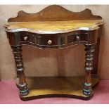 A really good 19th Century serpentine fronted Side Table with a three drawer frieze with turned