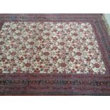 A good Burgundy Ground Carpet with multi borders and allover decoration. 335 x 255 cms.