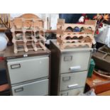 Two Filing Cabinets along with two wine racks and a stool.