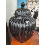 The property of The 5 star Hotel in London. A large Black reeded Ginger Jar with lid. 54 cms H.