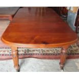 A good 19th Century mahogany Dining Table with two extra leaves and with a highly carved turned
