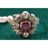 An early Victorian Ruby and Diamond cluster Ring set in rose gold. Approx diamond weight 1.5 - 2cts.