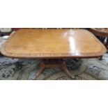 A Fantastic large Regency Mahogany Breakfast Table, the rectangular crossbanded tilt top upon four