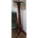 A wonderful 19th Century Mahogany Torchere with tripod base and carved shaft.