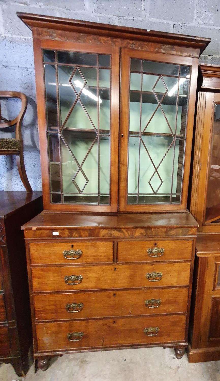 A lovely Regency Mahogany Bookcase/Display Cabinet with reeded beaded doors and chest base with