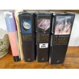 A set of three Harry Potter First Edition Books along with another.