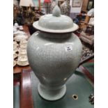 The property of The 5 star Hotel in London. A large lidded Urn with crackle effect. 52 cms H.