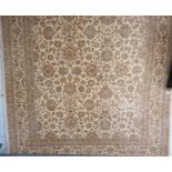 A Royal Keshan machine made cream ground Rug. 240 x 170cm