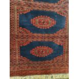 A good Red ground Rug with multi borders and allover decoration. 190 x 123 cms.