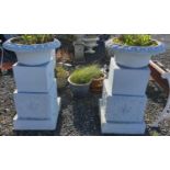 A large pair of reconstituted Stone Urns of unusual feature.