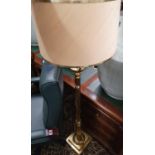 A 20th Century Brass Standard Lamp with reeded support.