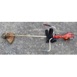 An Efco Strimmer with back strap.