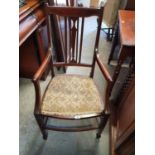 An Edwardian Mahogany and Inlaid Armchair.