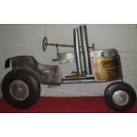 A wall mounted Tin Car.