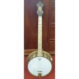 A Brass four string Banjo 'The Broadcaster' by J & A M, London. Circa 1920's.