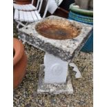 A reconstituted Stone Bird Bath.