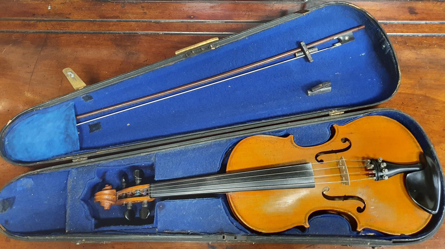 A good 19th Century full size one piece back Violin with bow in timber case.