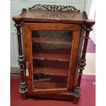 A 19th Century Walnut Side Cabinet with turned columned supports and glazed single door. Circa