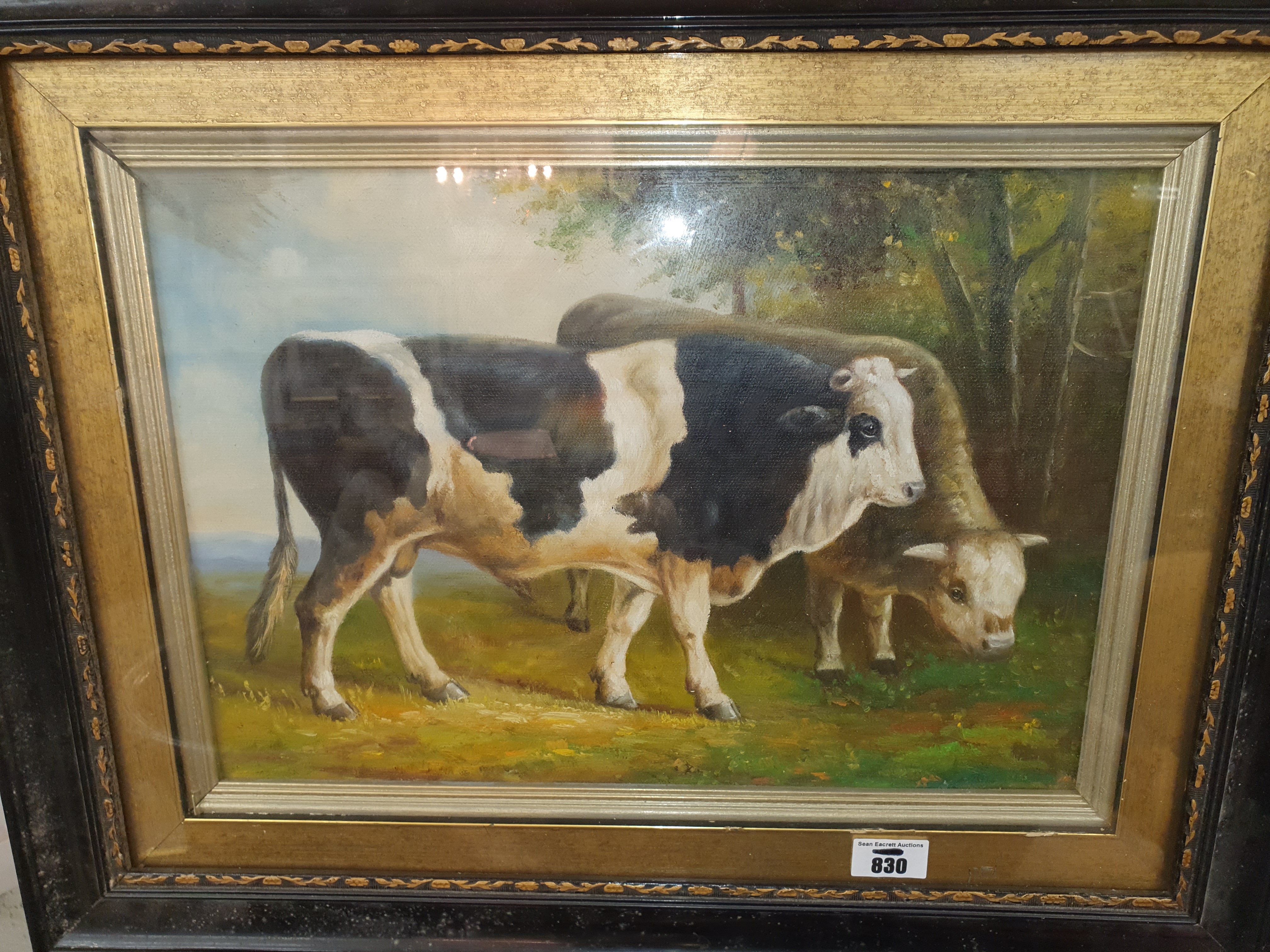 An oil on board of two Cattle.in a gilt and ebonised frame.