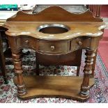 A good 19th Century Serpentine fronted Washstand with turned and fluted supports on a platform base.