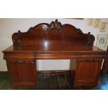 A Victorian Mahogany Pedestal Sideboard.