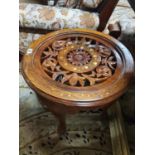A 20th Century Hardwood and Brass Circular wheel shaped Table. 53 cms diam.
