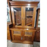 A really good Victorian Mahogany two door Bookcase with a bevelled glass top and carved panel bottom