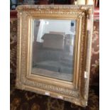 A good Victorian Plaster Gilt Mirror with bevelled glass. In need of restoration.