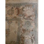 A Beige ground Rug.156w x 230 cms.