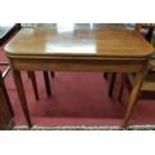 A Regency Mahogany Foldover Tea Table with boxwood inlay on tapered supports.Size W 91 x 44 x H