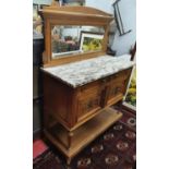 A late 19th Century walnut side Cabinet with marble top and mirrored gallery back.