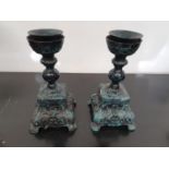 SILK ROAD: Two Metal Candlesticks.