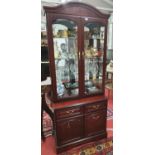 A good glazed Display Cabinet with lighted display and glass shelves.84w x base d 44 x 206h cms.