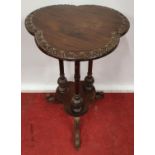 A carved Timber Mahogany Table.50w x 74h cms.