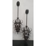 A pair of Metal wall mounted Hanging Lanterns.110h cms.